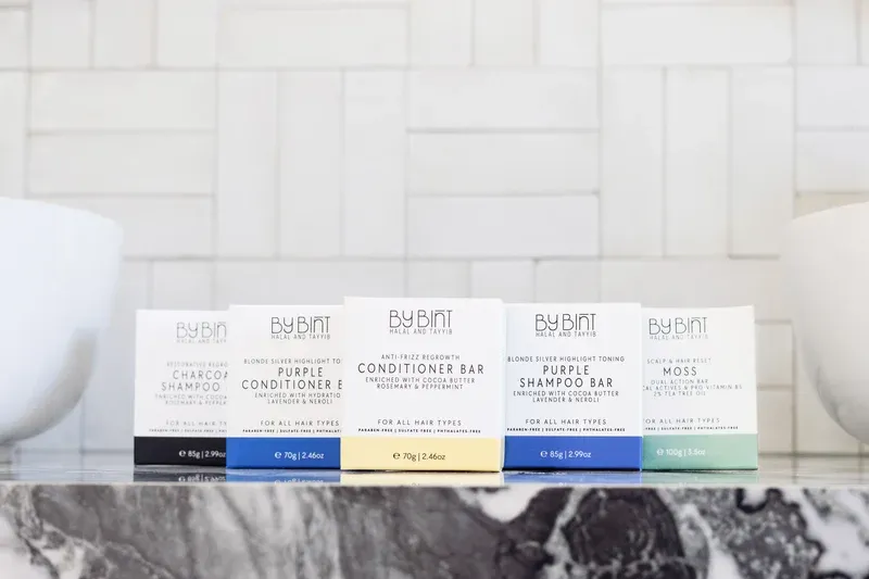 The full By Bint solid haircare range on marble